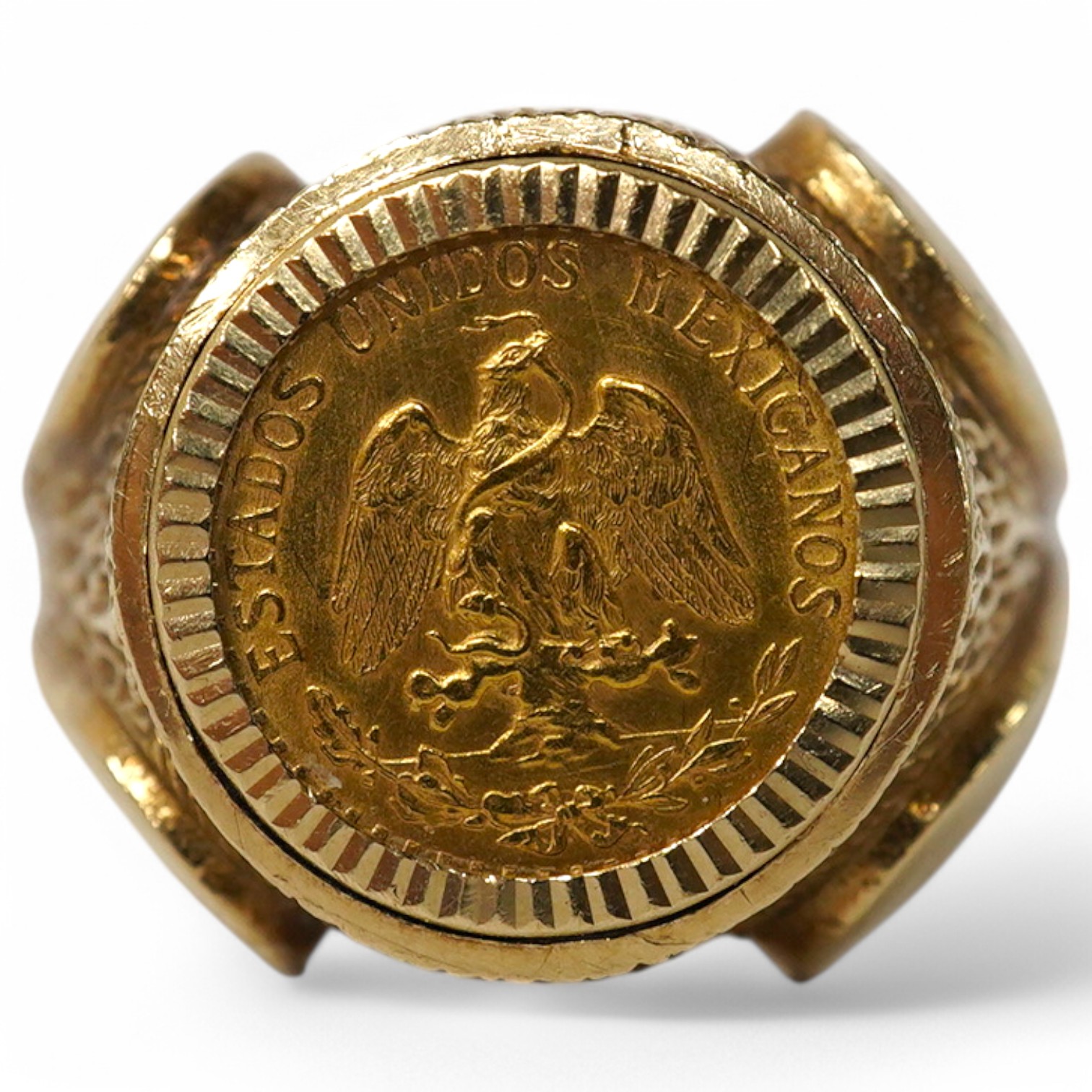 A 9ct gold ring set with a gold Mexican Two Peso coin, size R1/2, British hallmarks, gross weight approximately 9 grams. Condition - good, some scratches